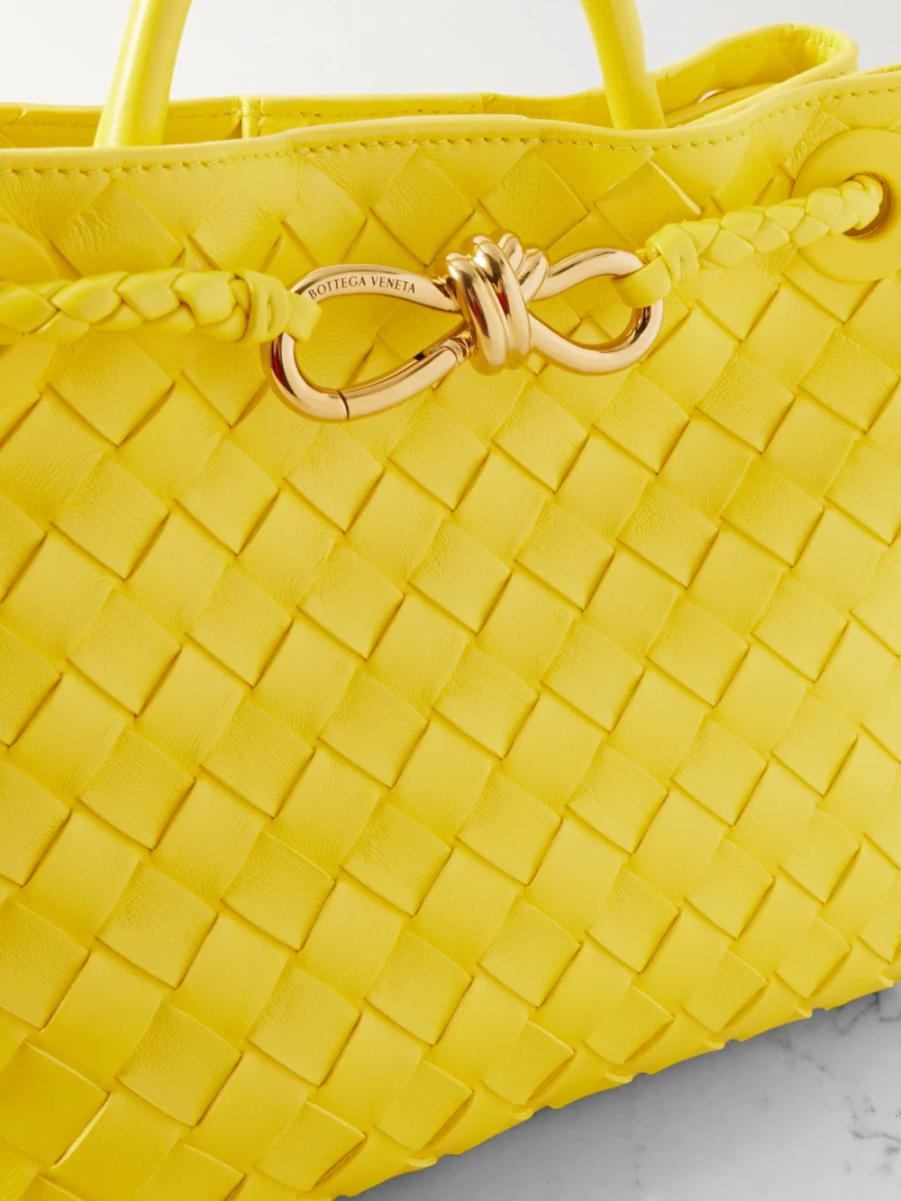 Close-up detail of the Bottega Veneta Andiamo Small Intrecciato Leather Top-handle Bag