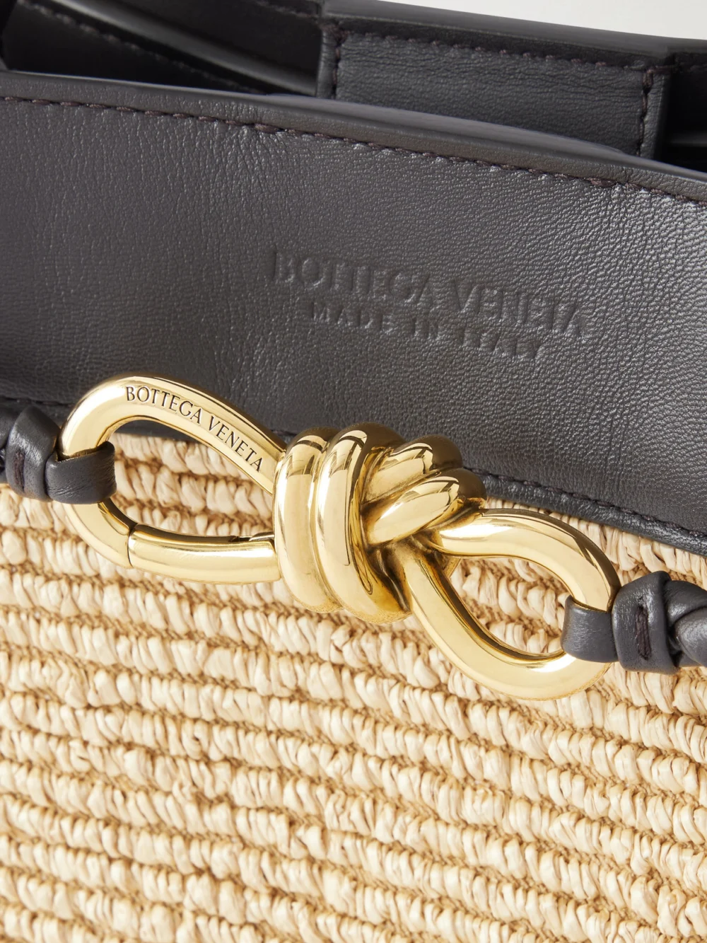 Close-up detail of the Bottega Veneta Andiamo Small Leather-trimmed Raffia Tote