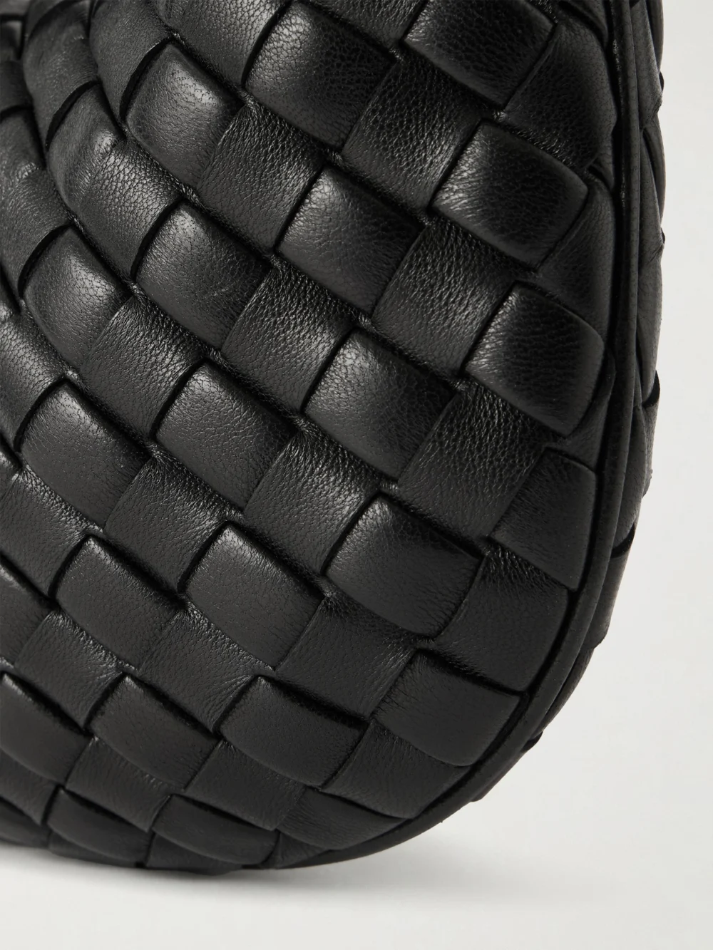 Close-up detail of the Bottega Veneta Baby Veneta Intrecciato Leather Top-handle Bag