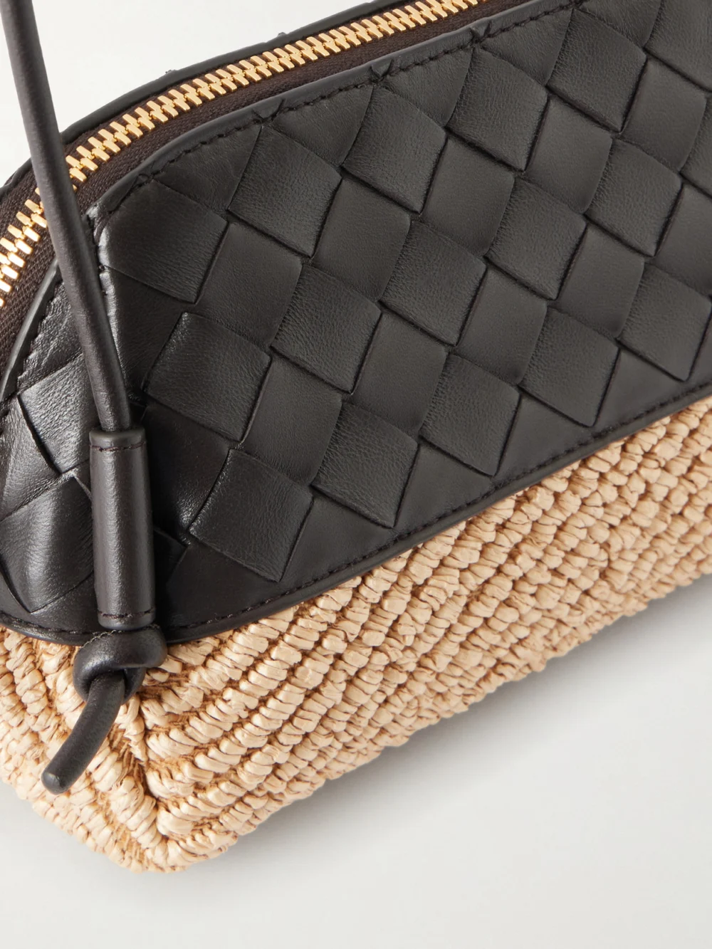 Close-up detail of the Bottega Veneta Concert Intrecciato Leather and Raffia Pouch