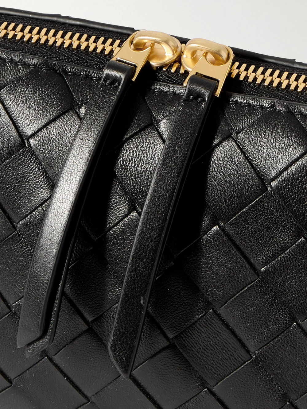 Close-up detail of the Bottega Veneta Concert Pouch Intrecciato Leather Shoulder Bag