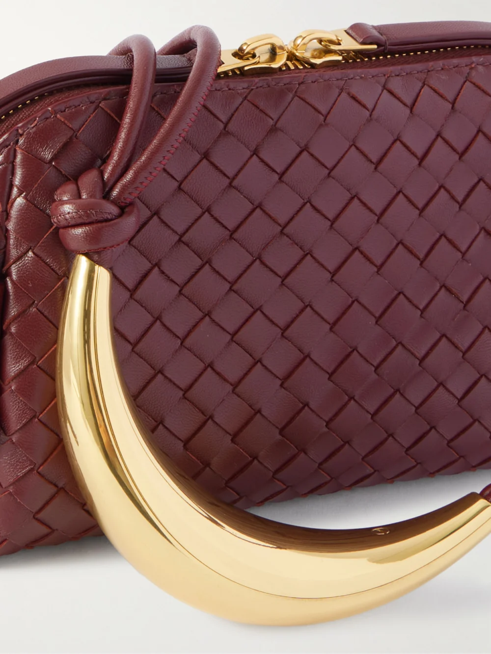 Close-up detail of the Bottega Veneta Concert Pouch Intrecciato Leather Shoulder Bag