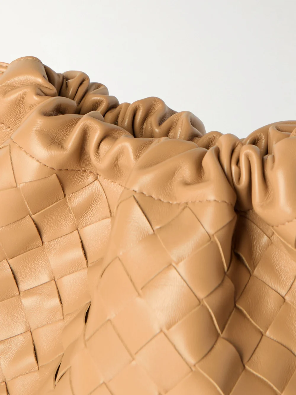 Close-up detail of the Bottega Veneta Dustbag Intrecciato Leather Pouch