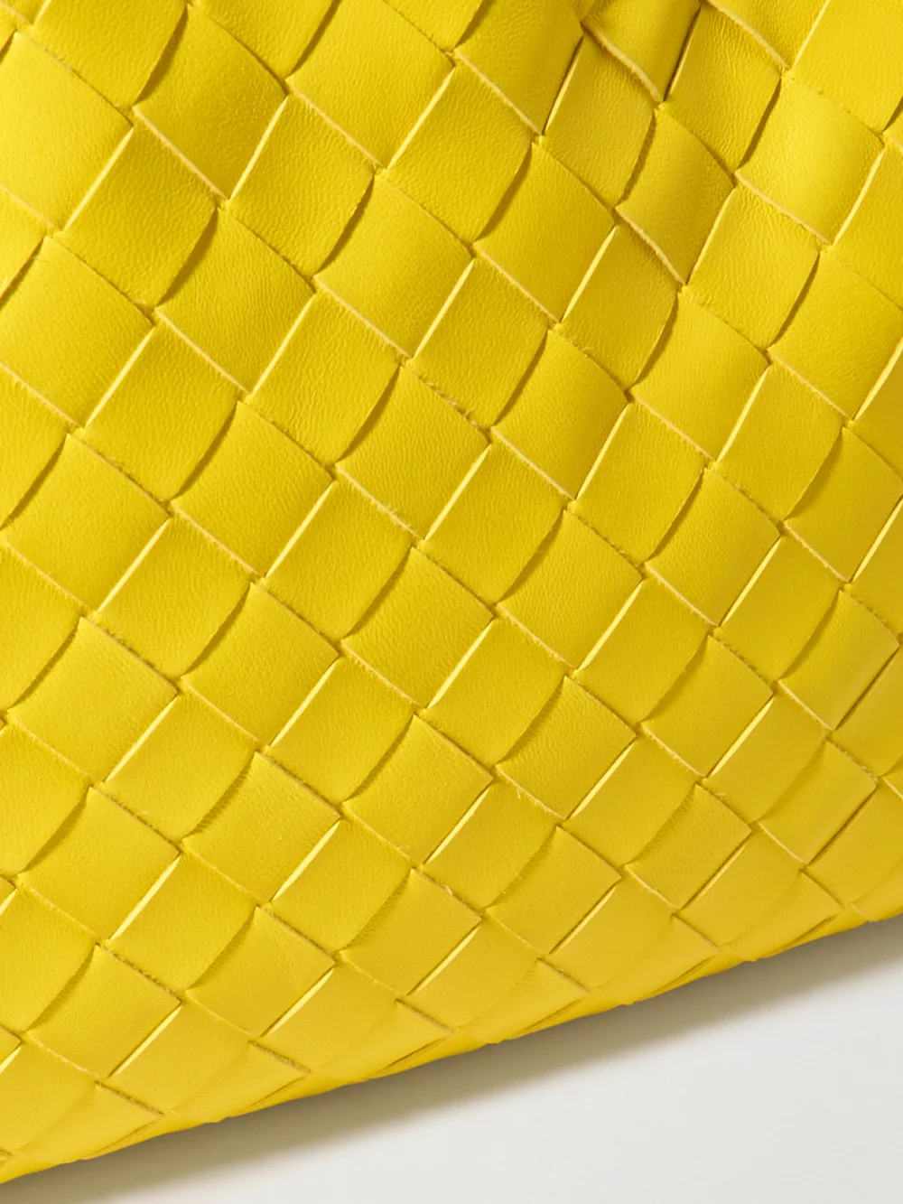 Close-up detail of the Bottega Veneta Dustbag Intrecciato Leather Pouch