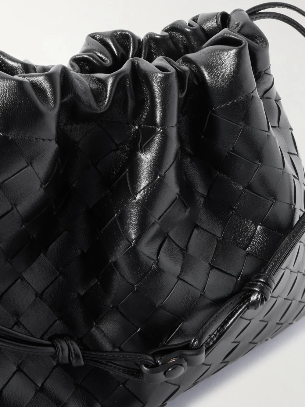 Close-up detail of the Bottega Veneta Dustbag Medium Intrecciato Leather Clutch