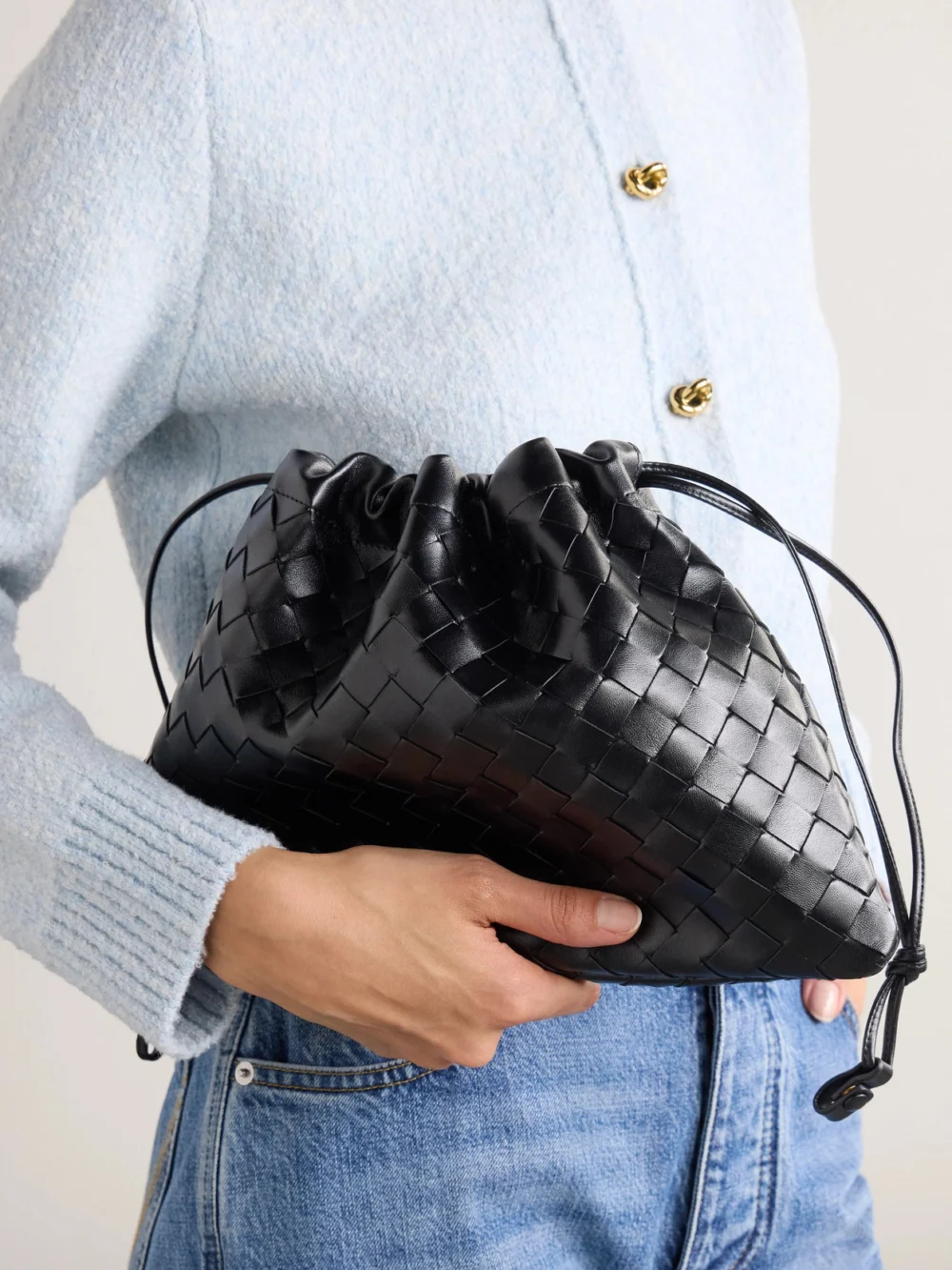 Bottega Veneta Dustbag Medium Intrecciato Leather Clutch, styled view
