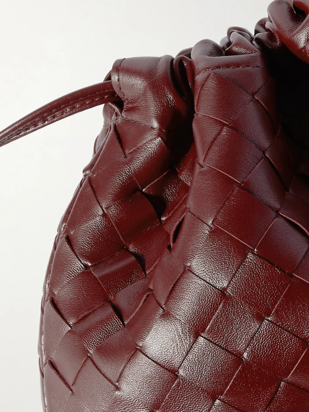 Close-up detail of the Bottega Veneta Dustbag Small Intrecciato Leather Clutch