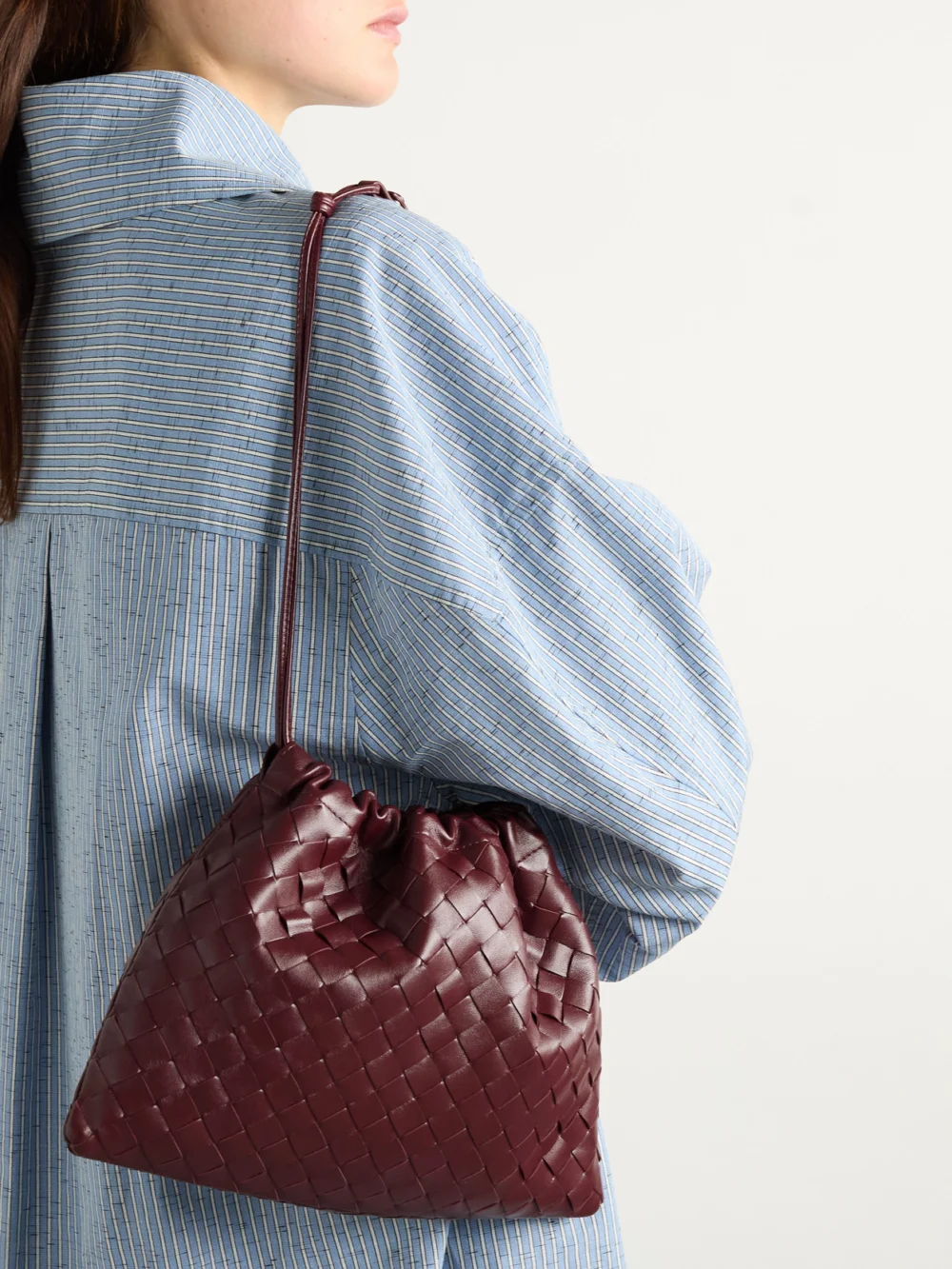 Bottega Veneta Dustbag Small Intrecciato Leather Clutch, styled view