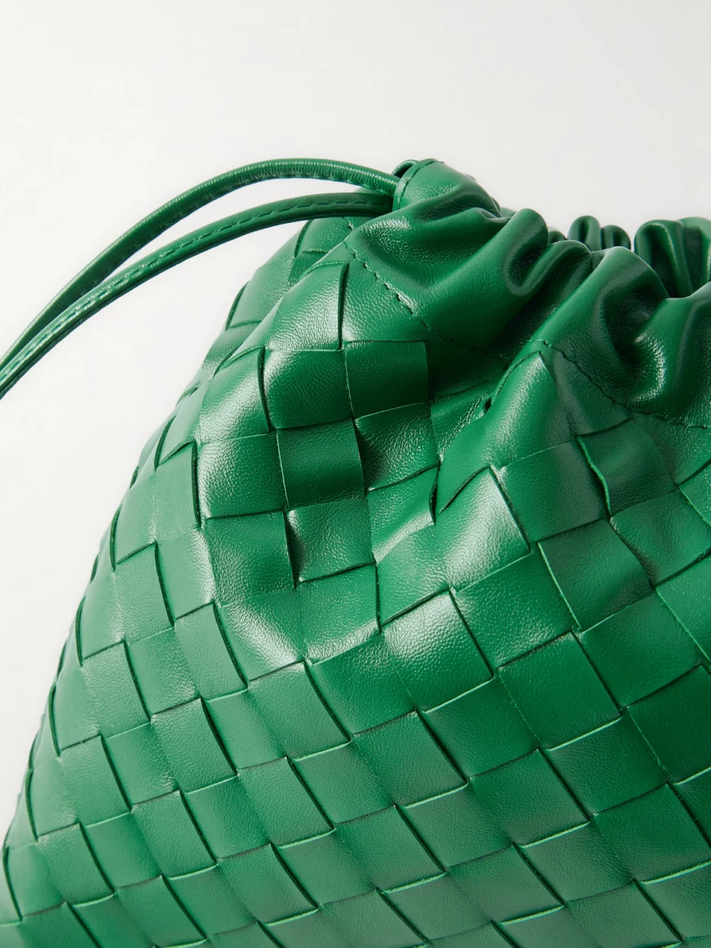 Close-up detail of the Bottega Veneta Dustbag Small Intrecciato Leather Pouch