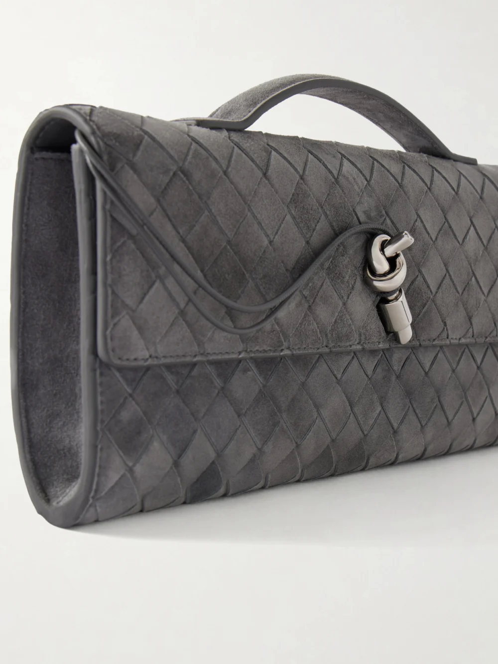 Close-up detail of the Bottega Veneta Intrecciato Suede Clutch