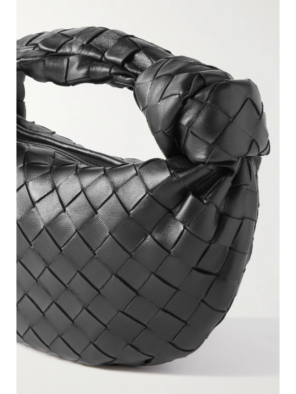 Close-up detail of the Bottega Veneta Jodie Mini Intrecciato Leather Tote