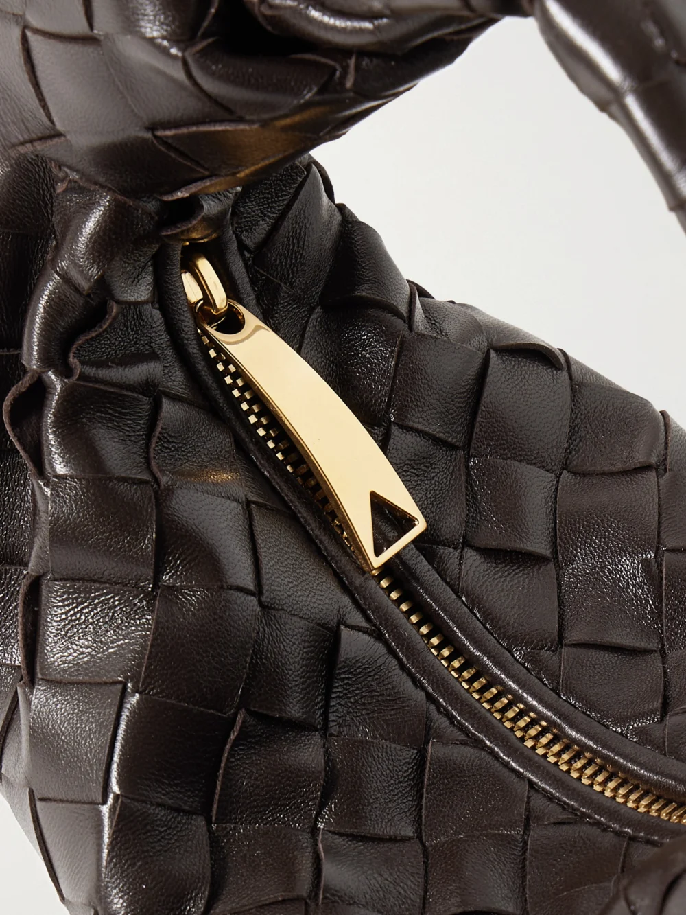 Close-up detail of the Bottega Veneta Jodie Mini Intrecciato Leather Tote