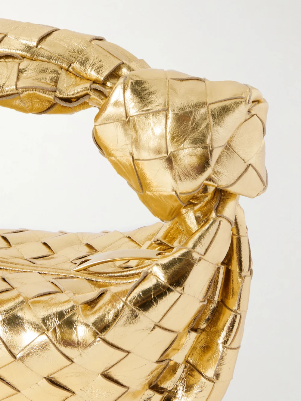 Close-up detail of the Bottega Veneta Jodie Mini Intrecciato Metallic Leather Tote