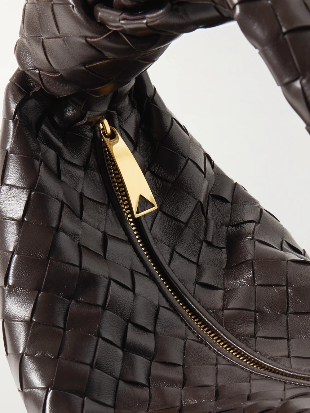 Close-up detail of the Bottega Veneta Jodie Small Intrecciato Leather Tote
