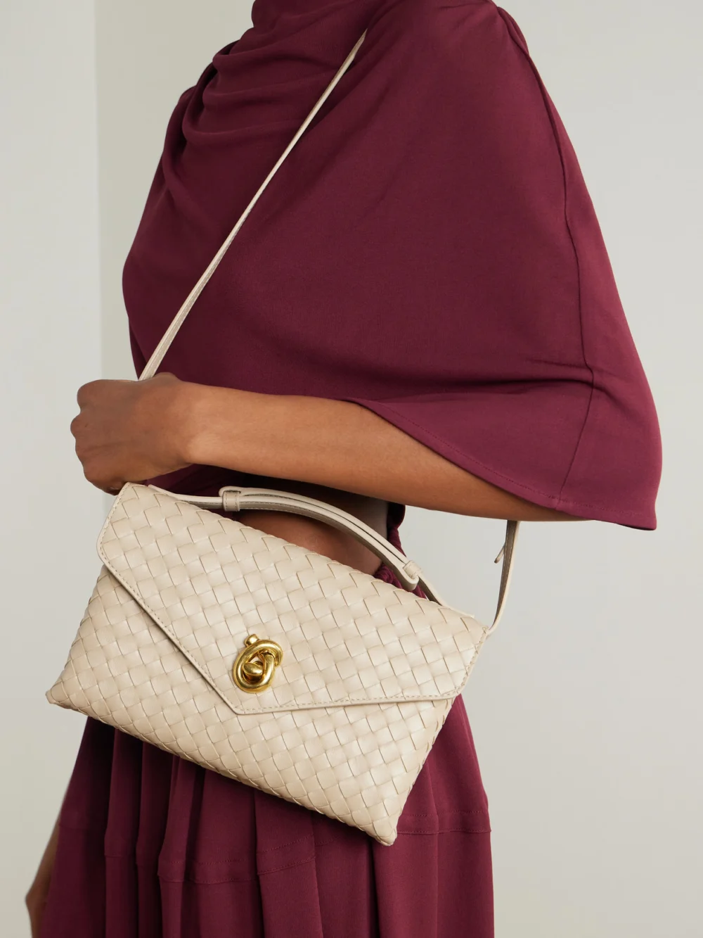 Bottega Veneta Knot Lock Medium Intrecciato Leather Top-handle Bag, styled view