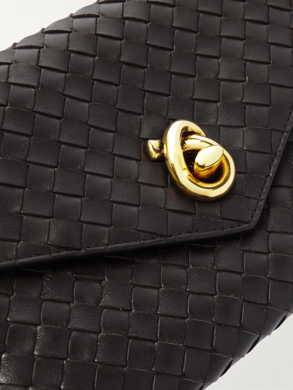Close-up detail of the Bottega Veneta Knot Lock Medium Intrecciato Leather Top-handle Bag