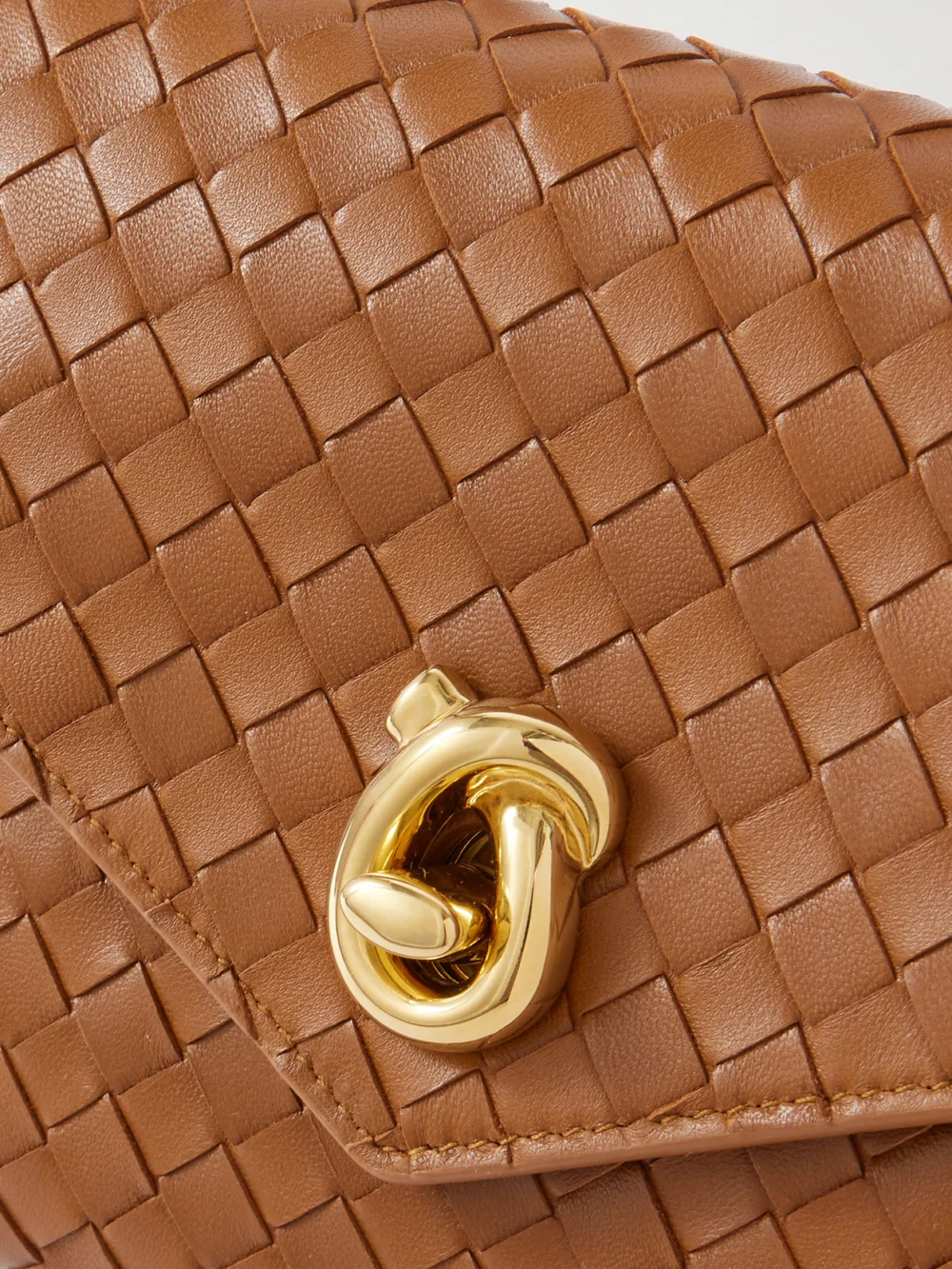 Close-up detail of the Bottega Veneta Knot Lock Medium Intrecciato Leather Top-handle Bag