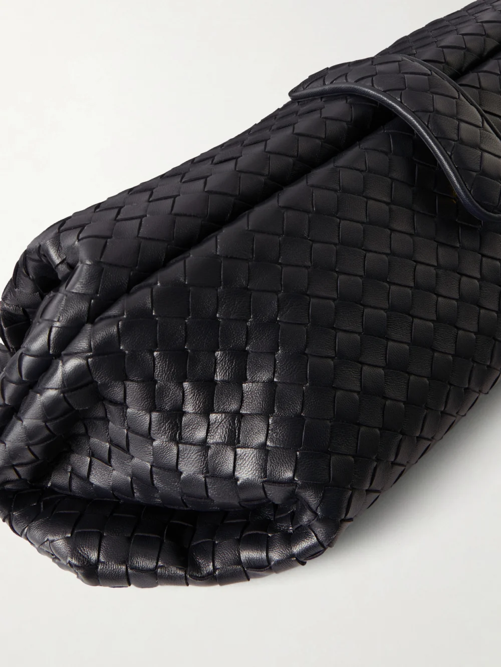Close-up detail of the Bottega Veneta Lauren 1979 Intrecciato Leather Clutch