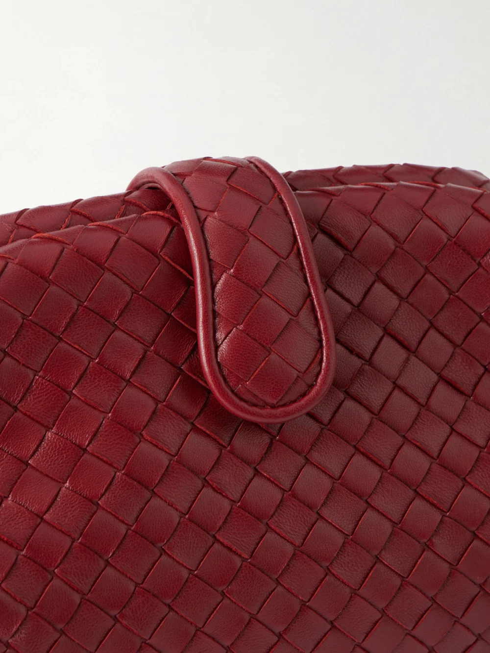 Close-up detail of the Bottega Veneta Lauren 1980 Intrecciato Leather Clutch