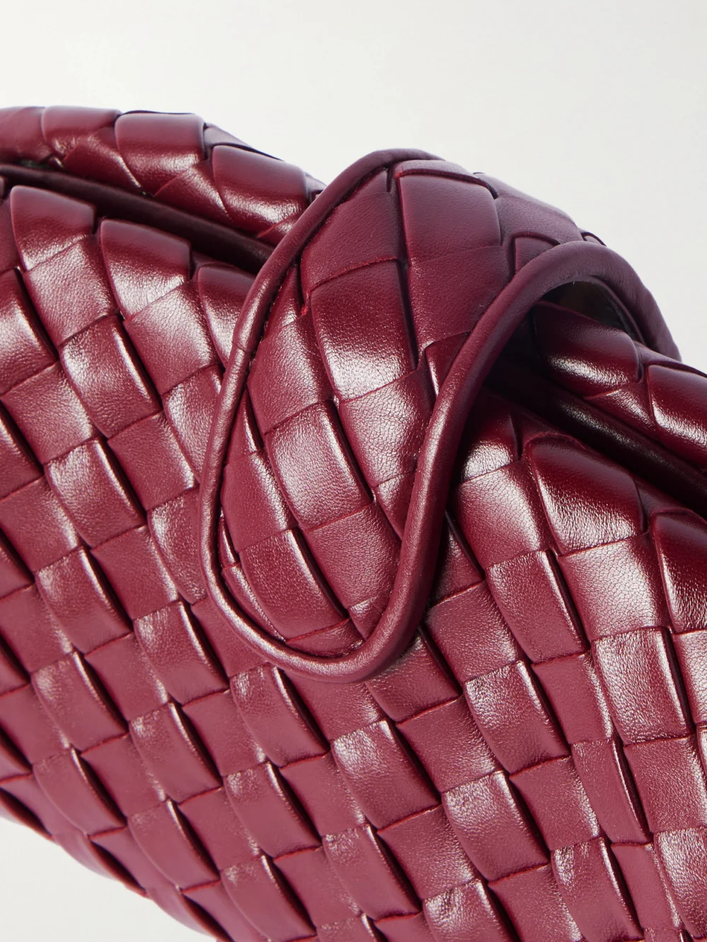 Close-up detail of the Bottega Veneta Lauren 1980 Teen Small Intrecciato Leather Clutch