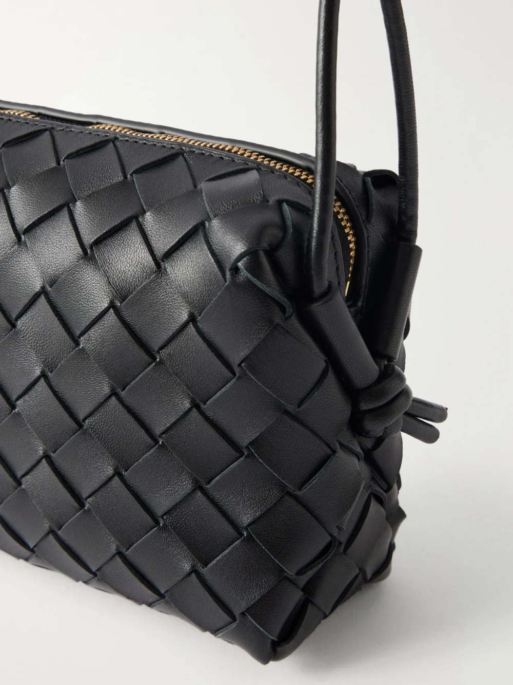 Close-up detail of the Bottega Veneta Loop Mini Intrecciato Leather Shoulder Bag