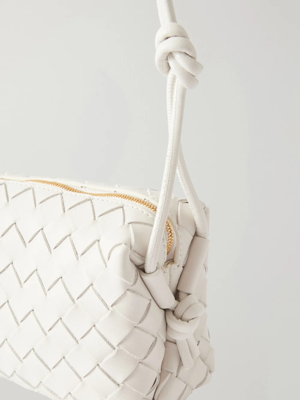 Close-up detail of the Bottega Veneta Loop Mini Intrecciato Leather Shoulder Bag