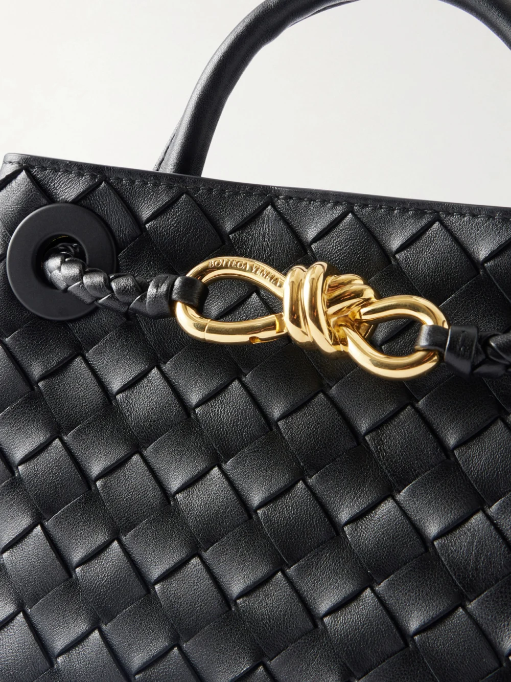 Close-up detail of the Bottega Veneta Mini Andiamo Intrecciato Leather Tote