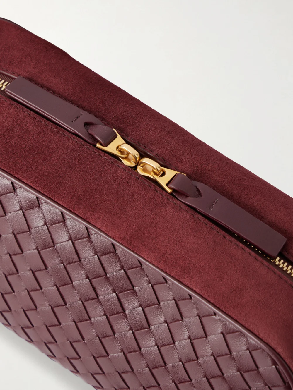 Close-up detail of the Bottega Veneta Nodo Small Intrecciato Suede-trimmed Leather Pouch