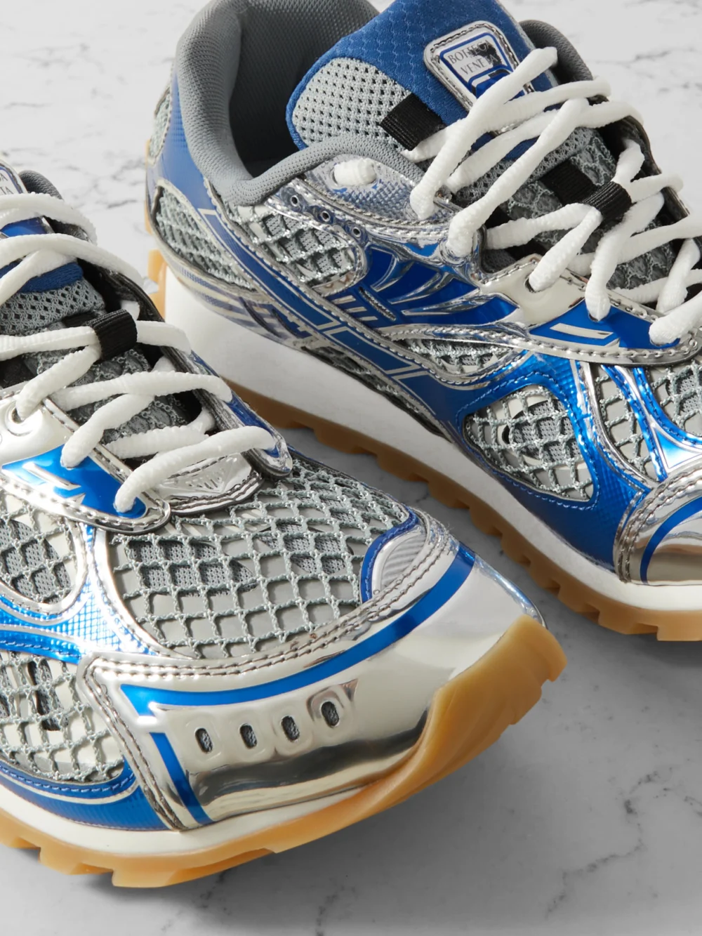 Close-up detail of the Bottega Veneta Orbit Metallic Rubber, Mesh and Fishnet Sneakers