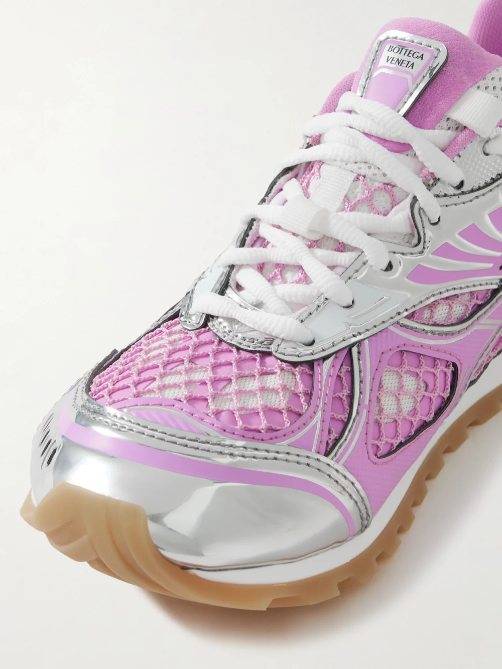 Close-up detail of the Bottega Veneta Orbit Metallic Rubber, Mesh and Fishnet Sneakers