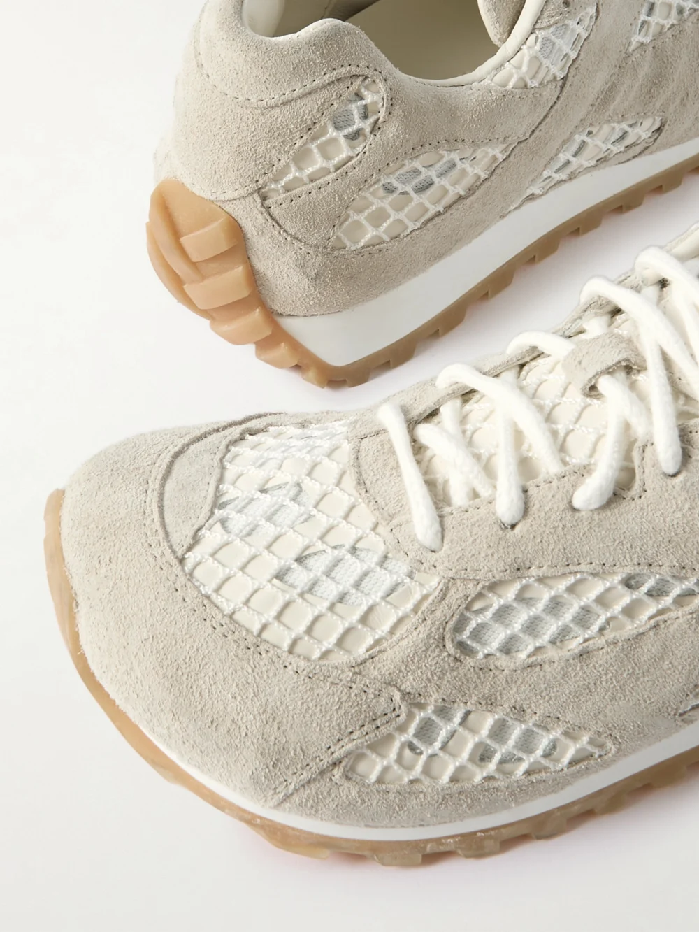 Close-up detail of the Bottega Veneta Orbit Suede, Leather, Mesh and Fishnet Sneakers