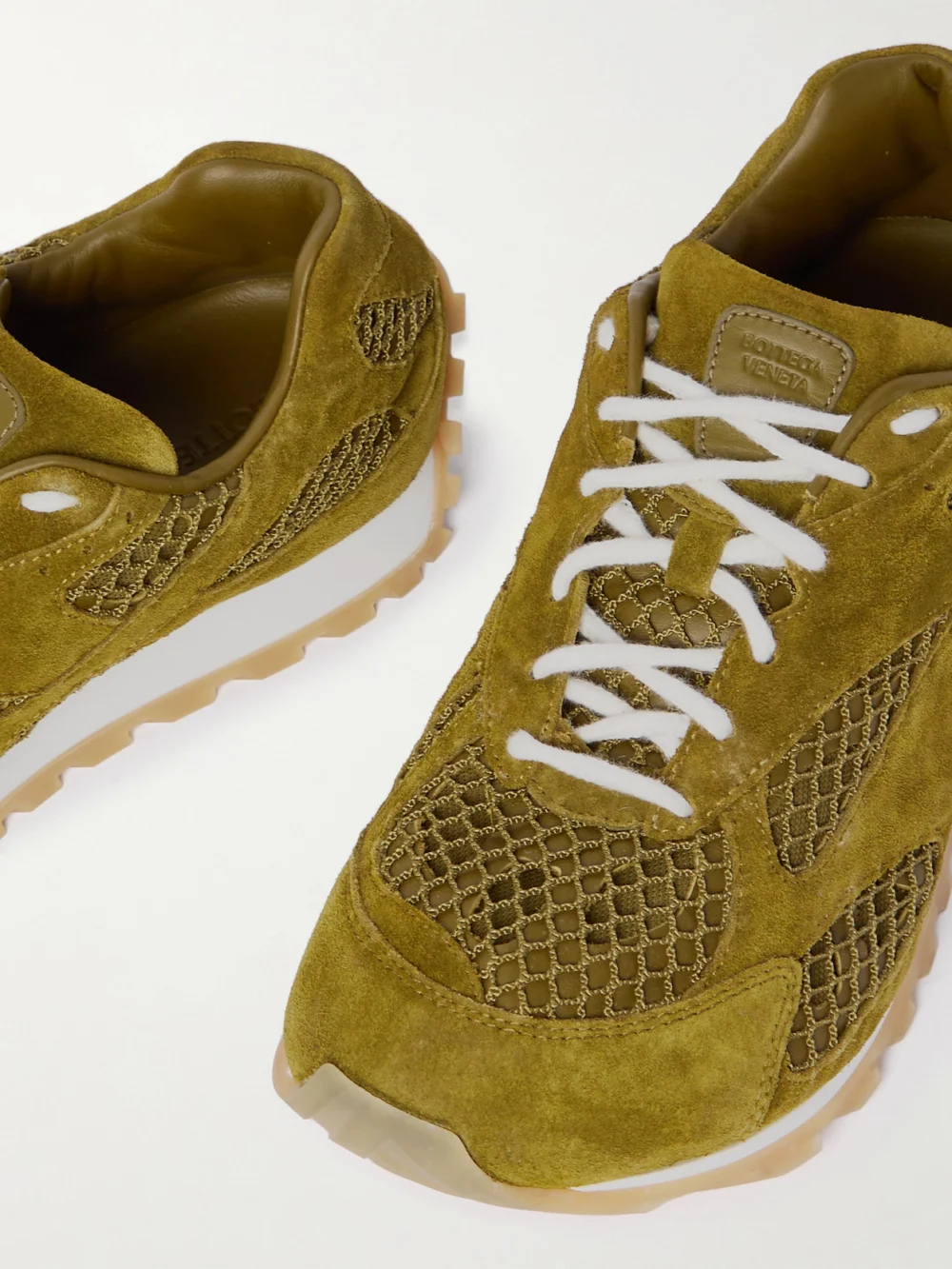 Close-up detail of the Bottega Veneta Orbit Suede, Leather, Mesh and Fishnet Sneakers