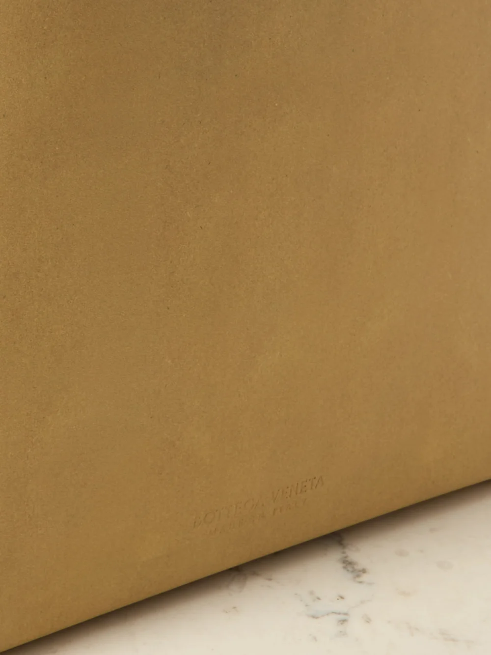 Close-up detail of the Bottega Veneta The Small Brown Bag Suede Tote