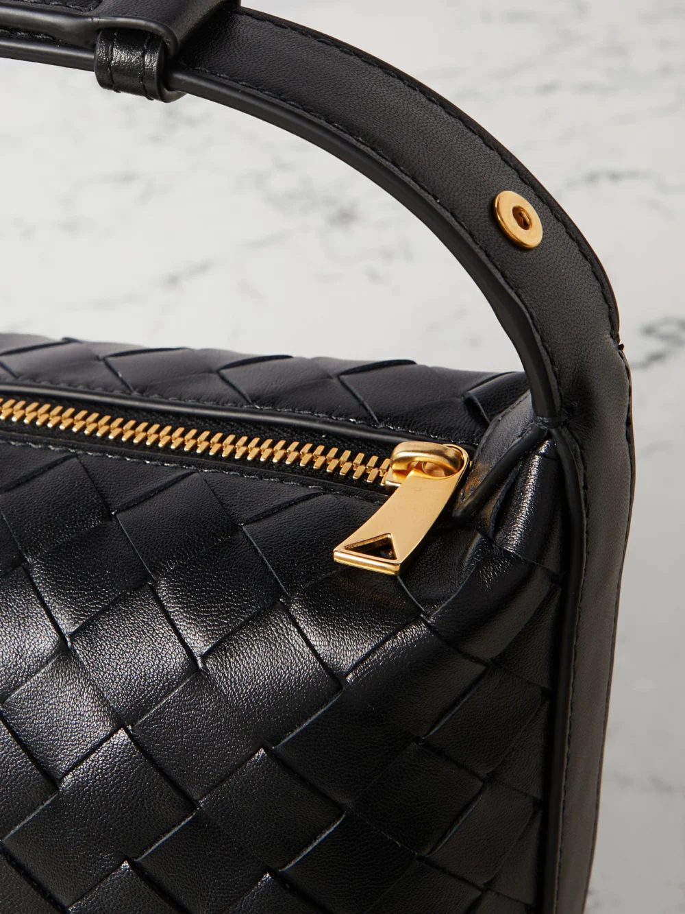 Close-up detail of the Bottega Veneta Wallace Mini Intrecciato Leather Shoulder Bag