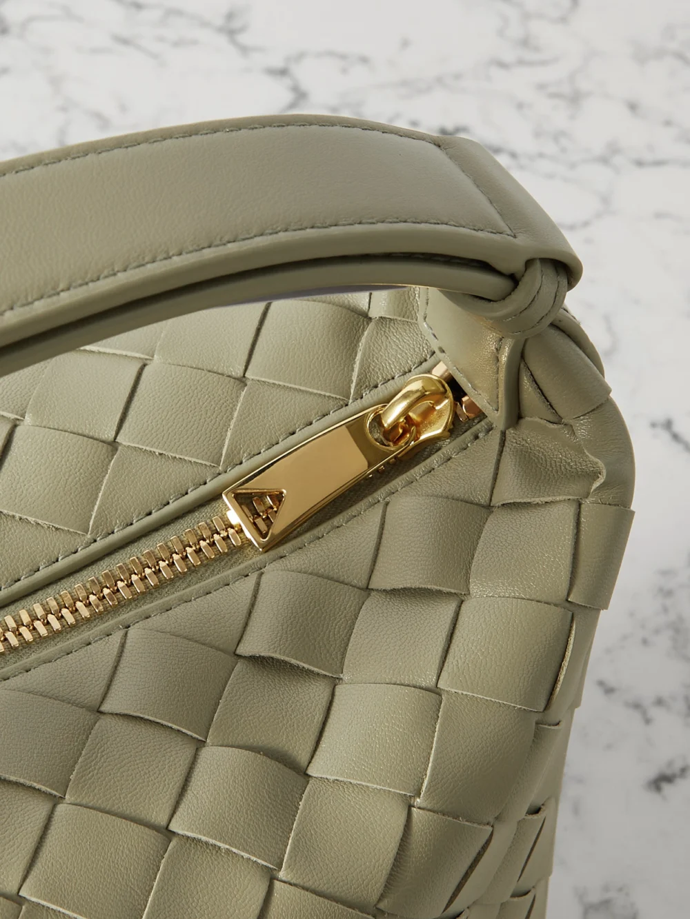 Close-up detail of the Bottega Veneta Wallace Mini Intrecciato Leather Shoulder Bag