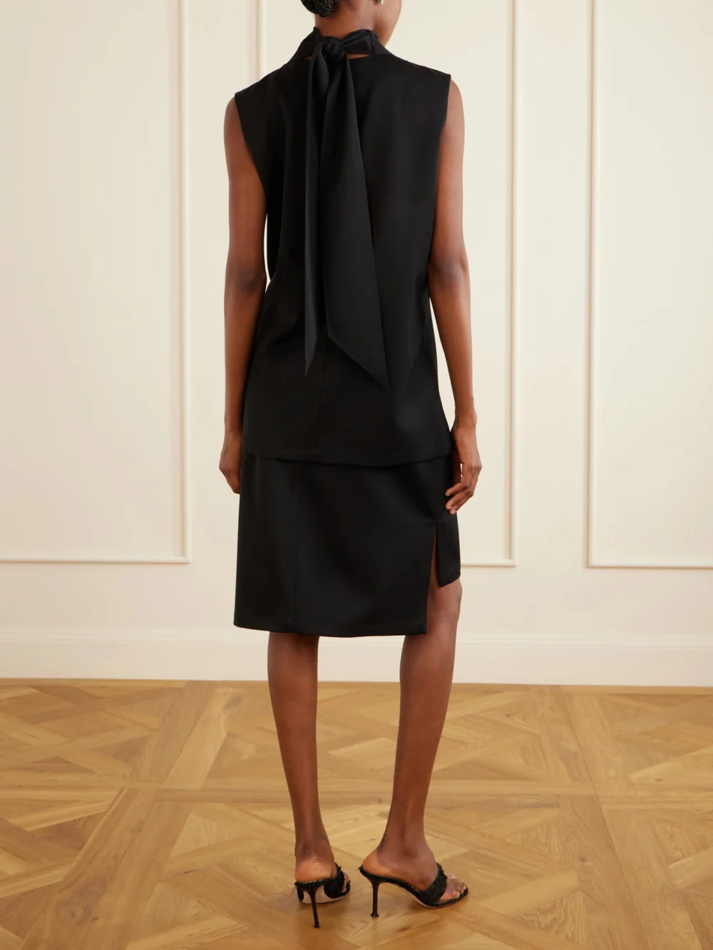 Back view of the Brandon Maxwell The Noa Gathered Wool-twill Turtleneck Mini Dress