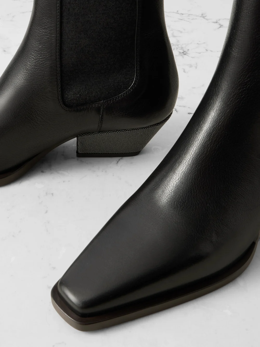 Close-up detail of the Brunello Cucinelli Bead-embellished Leather Ankle Boots