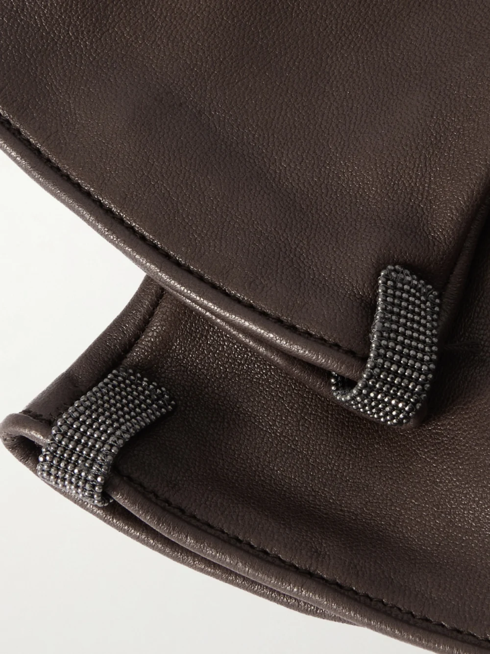 Close-up detail of the Brunello Cucinelli Bead-embellished Leather Gloves