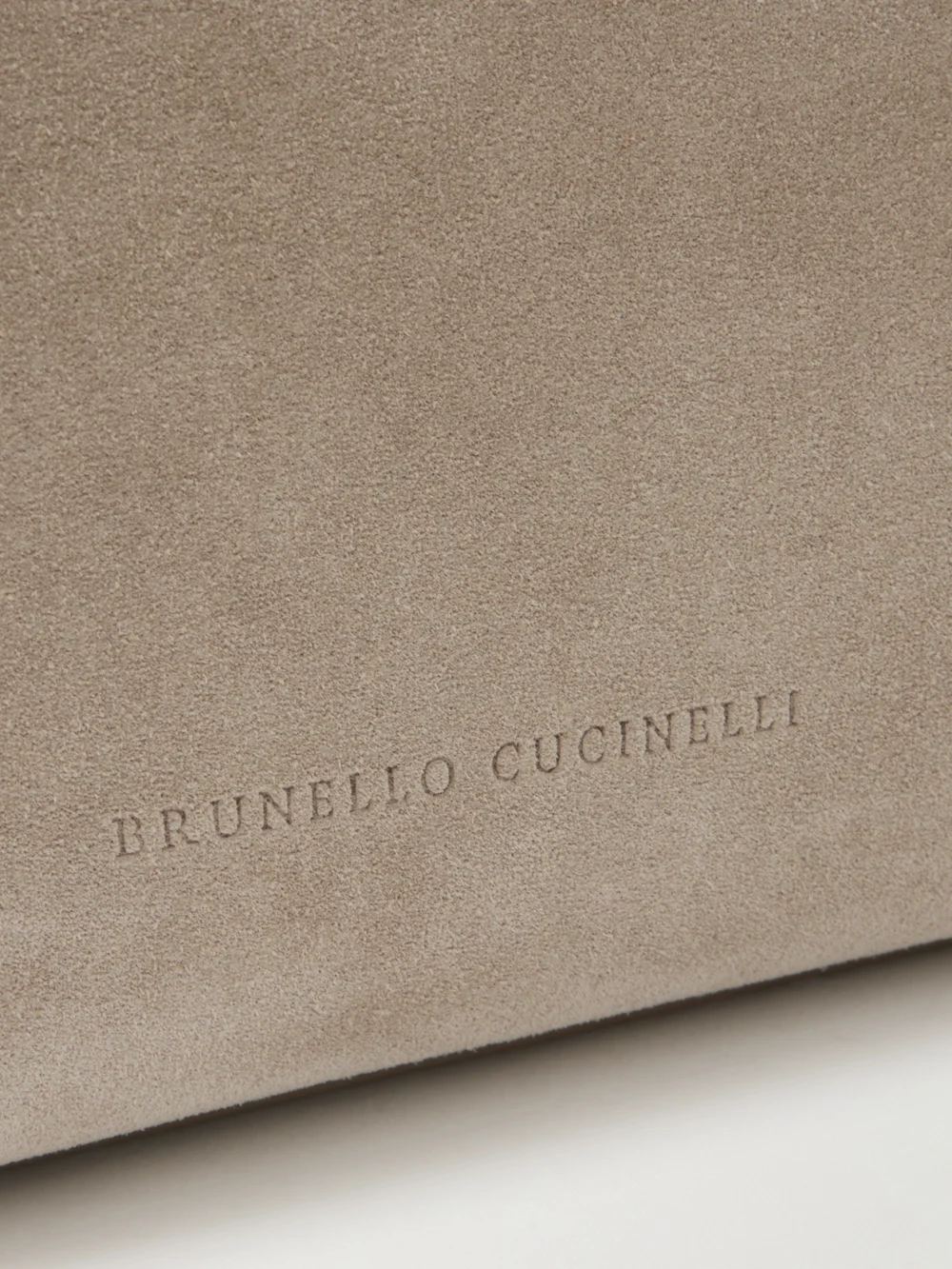 Close-up detail of the Brunello Cucinelli Bead-embellished Leather-trimmed Suede Clutch