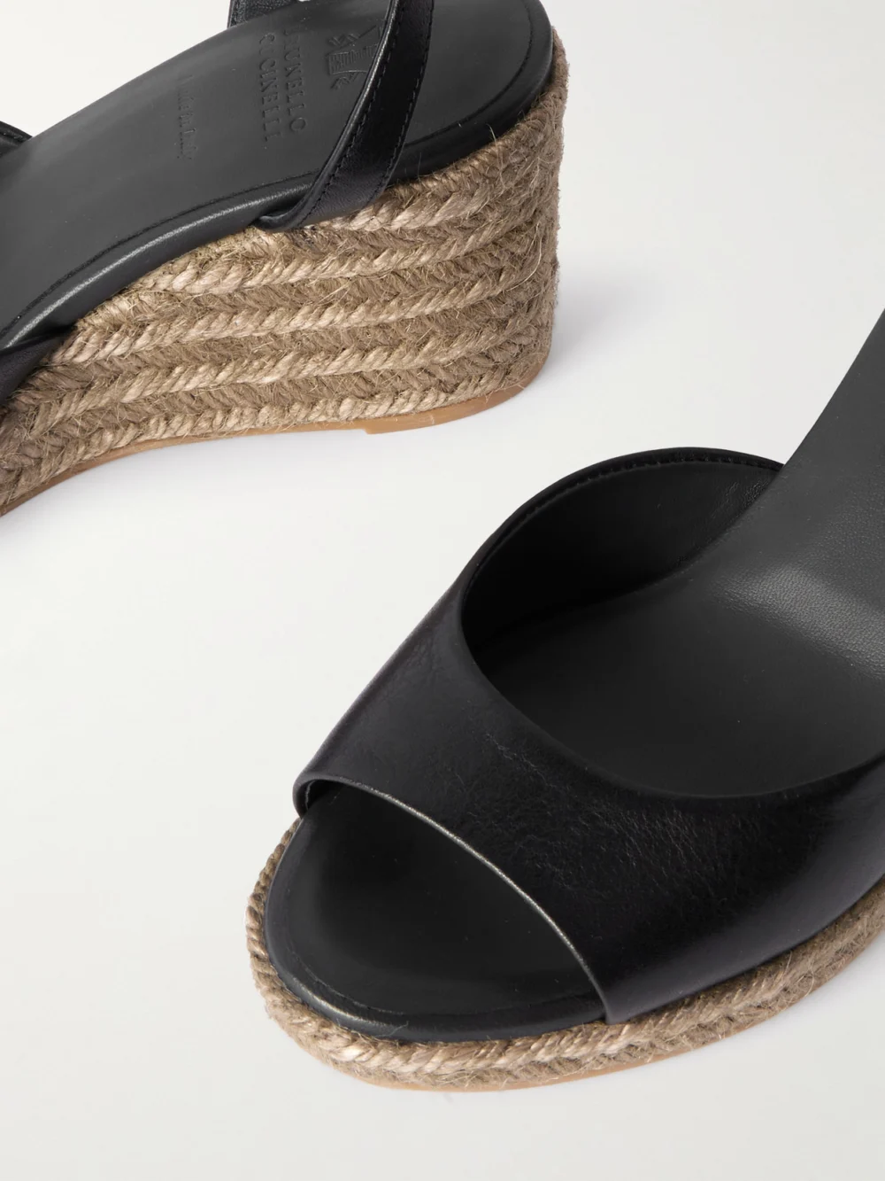 Close-up detail of the Brunello Cucinelli Bead-embellished Leather Wedge Espadrilles