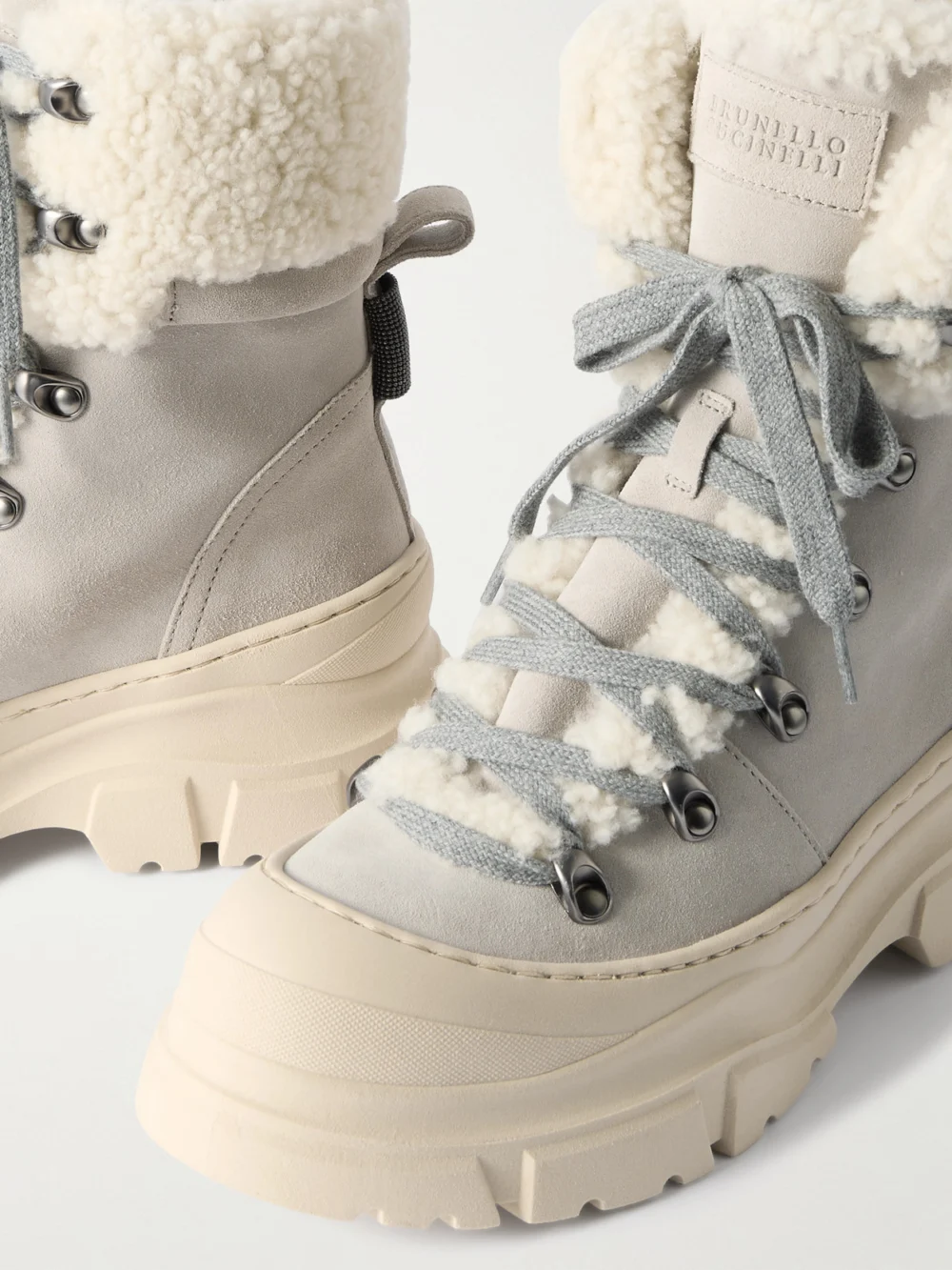 Close-up detail of the Brunello Cucinelli Bead-embellished Shearling-lined Suede Ankle Boots