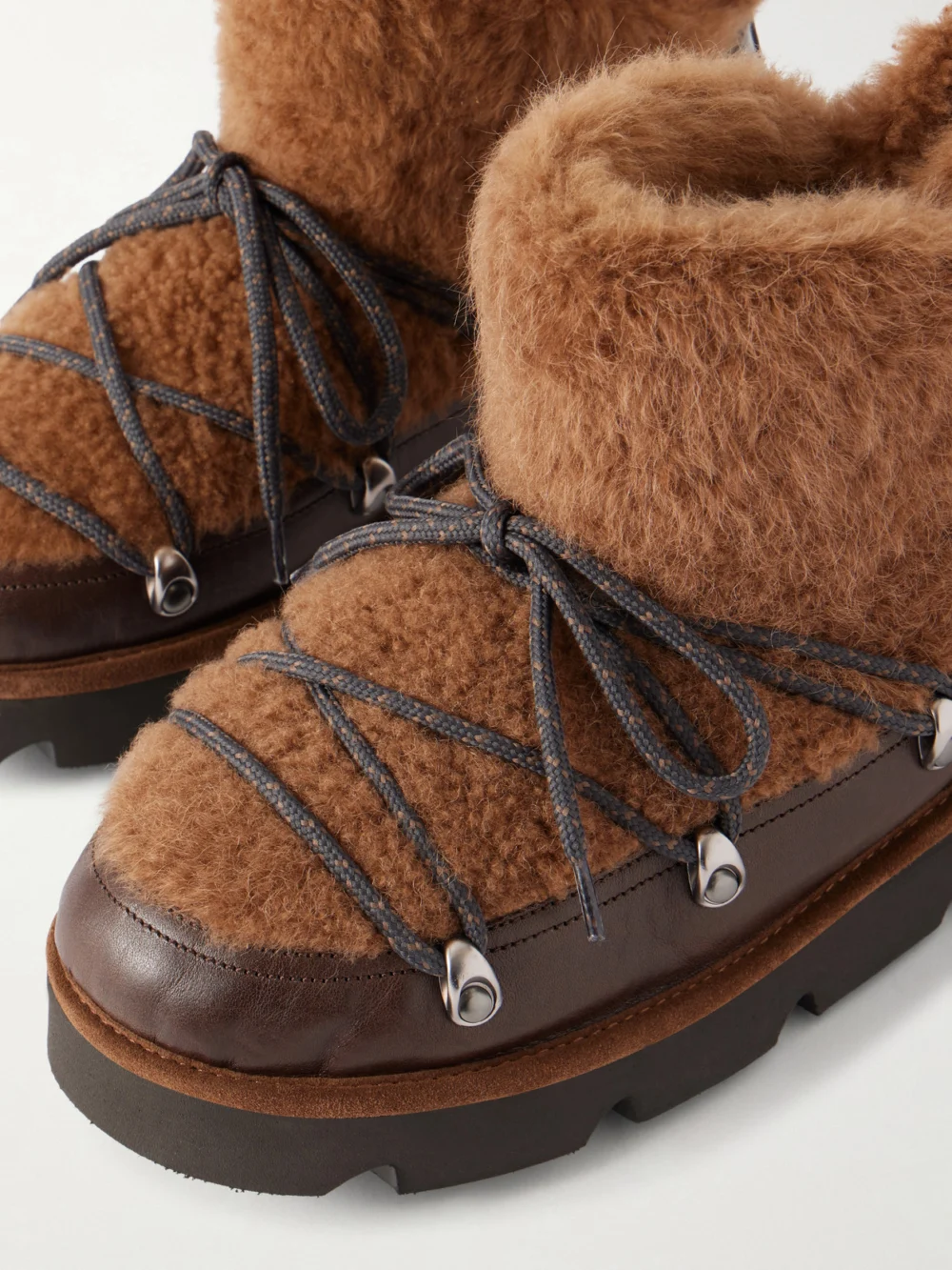 Close-up detail of the Brunello Cucinelli Bead-embellished Shearling-trimmed Leather Ankle Boots