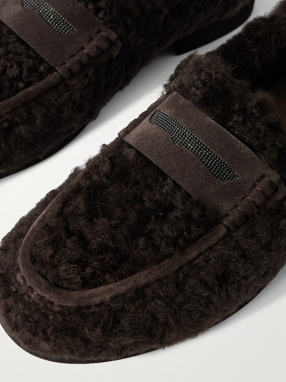 Close-up detail of the Brunello Cucinelli Bead-embellished Suede-trimmed Shearling Loafers