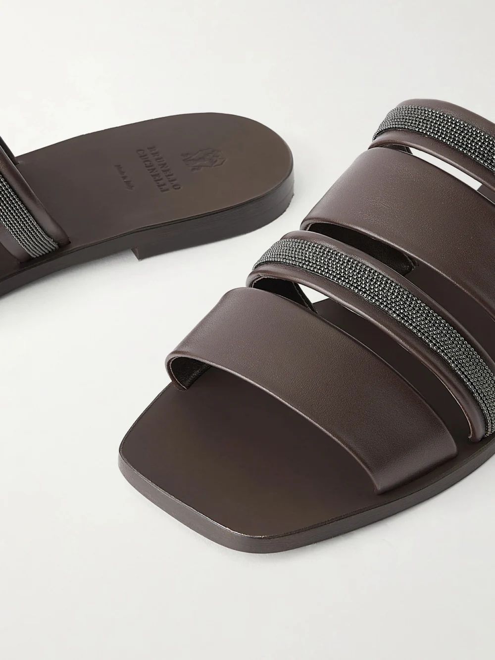 Close-up detail of the Brunello Cucinelli Embellished Leather Sandals