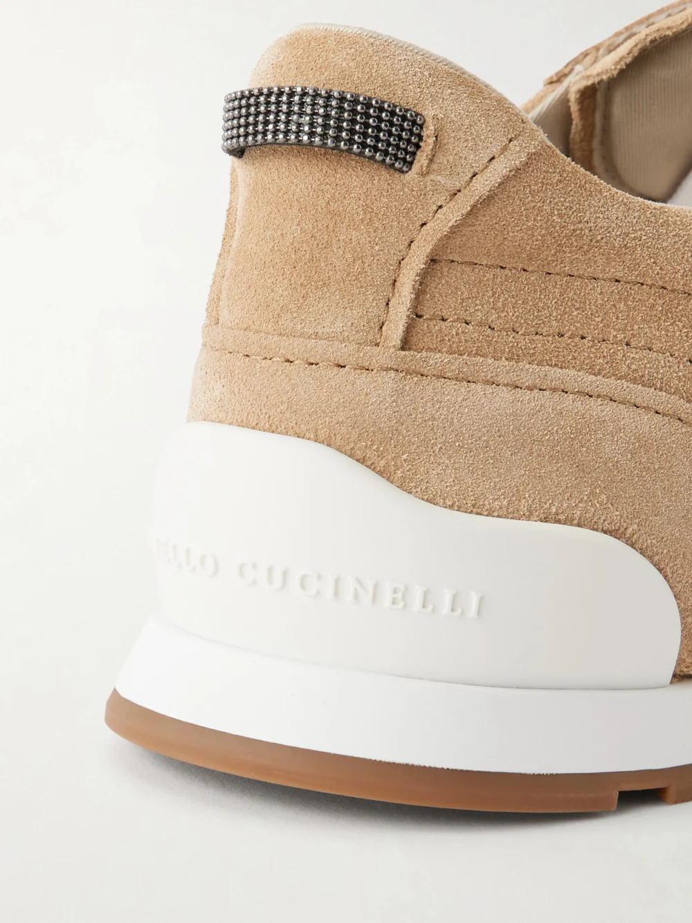 Close-up detail of the Brunello Cucinelli Embellished Suede Sneakers
