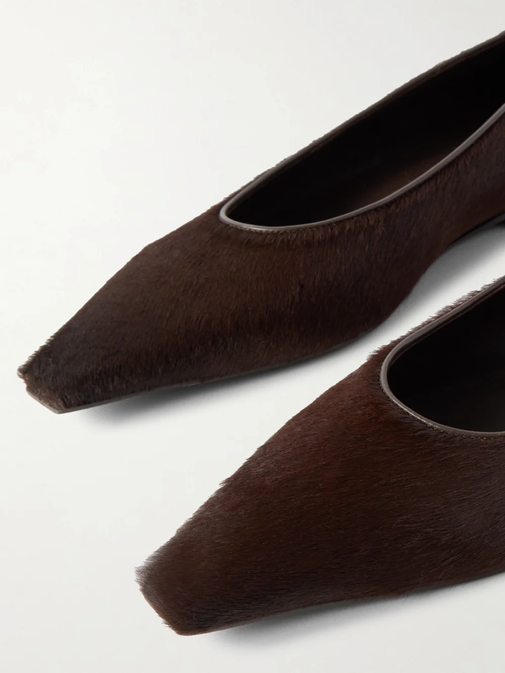 Close-up detail of the Brunello Cucinelli Leather-trimmed Calf Hair Point-toe Flats
