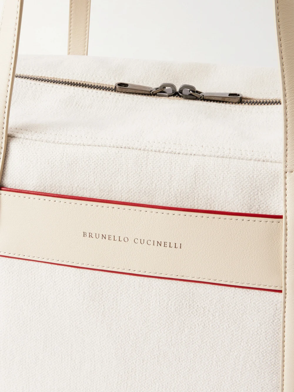Close-up detail of the Brunello Cucinelli Leather-trimmed Canvas Tennis Bag