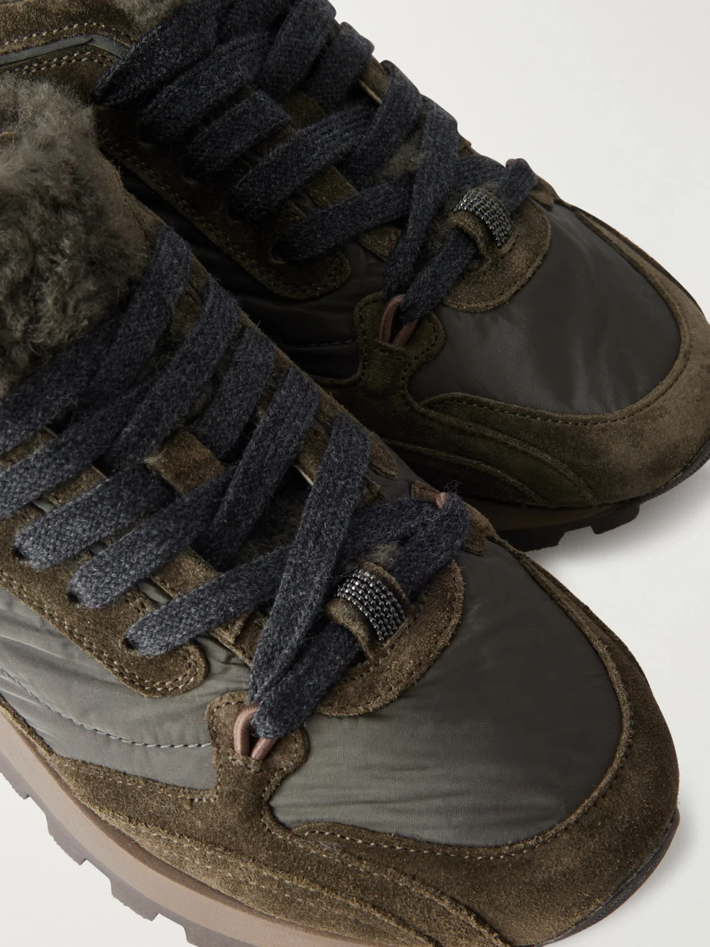 Close-up detail of the Brunello Cucinelli Shearling-trimmed Shell and Suede Sneakers