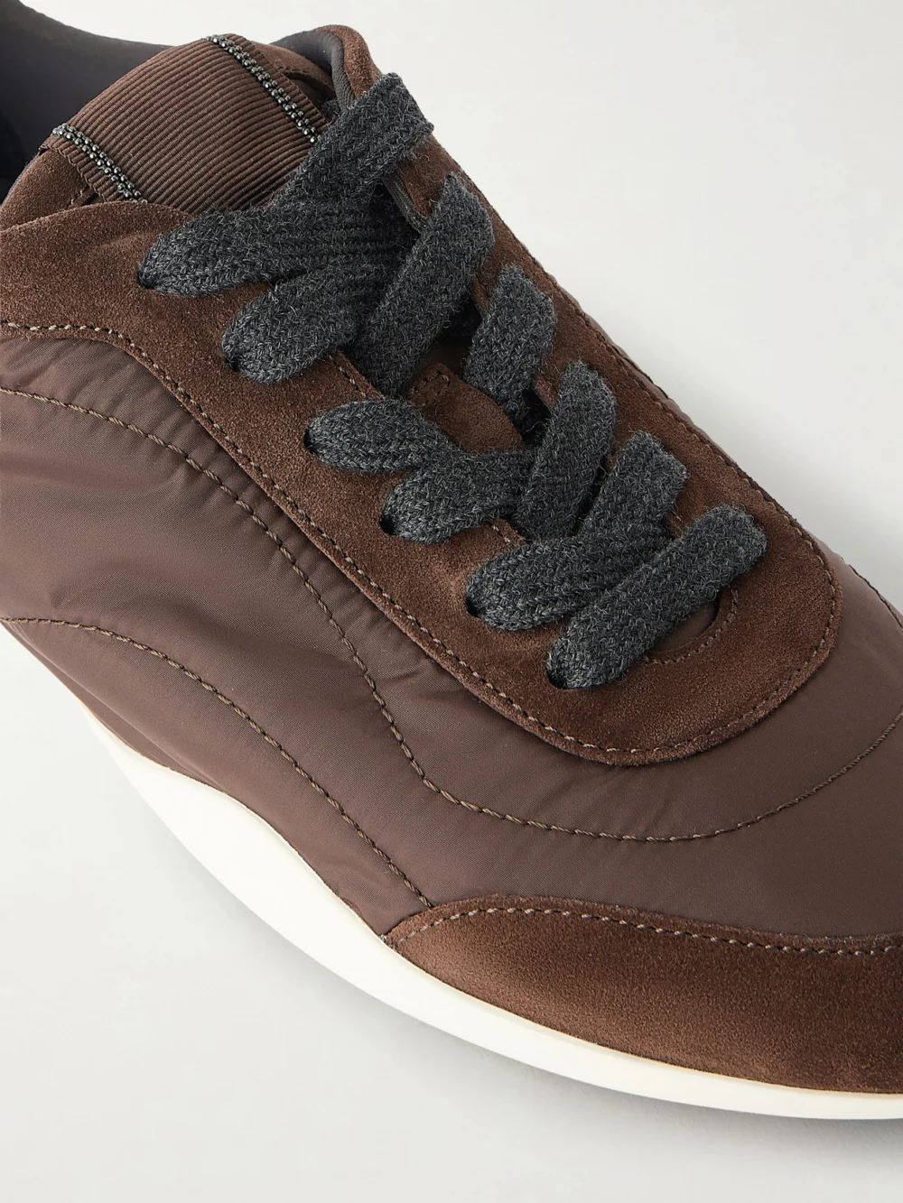Close-up detail of the Brunello Cucinelli Shell and Suede Sneakers