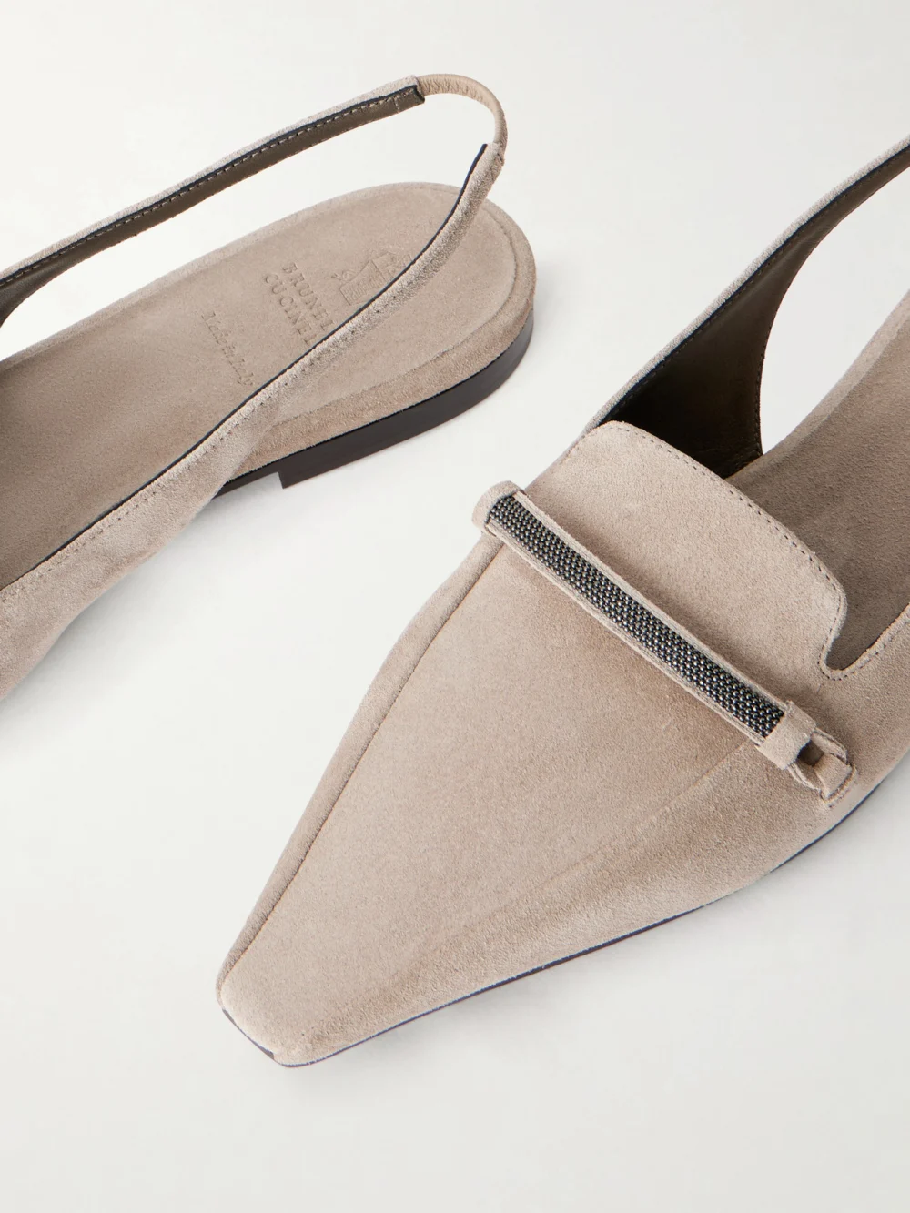 Close-up detail of the Brunello Cucinelli Suede Pointed-toe Slingback Flats